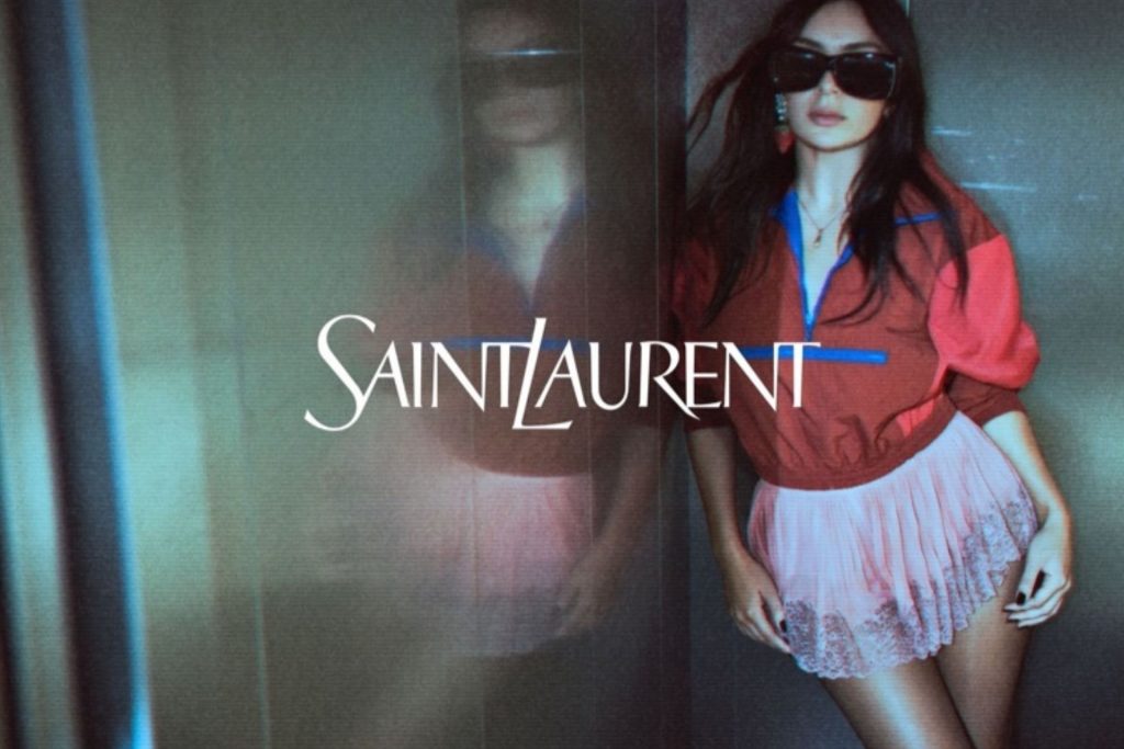 Charli XCX wearing 2026 Saint Laurent retro clothes and huge sunglasses