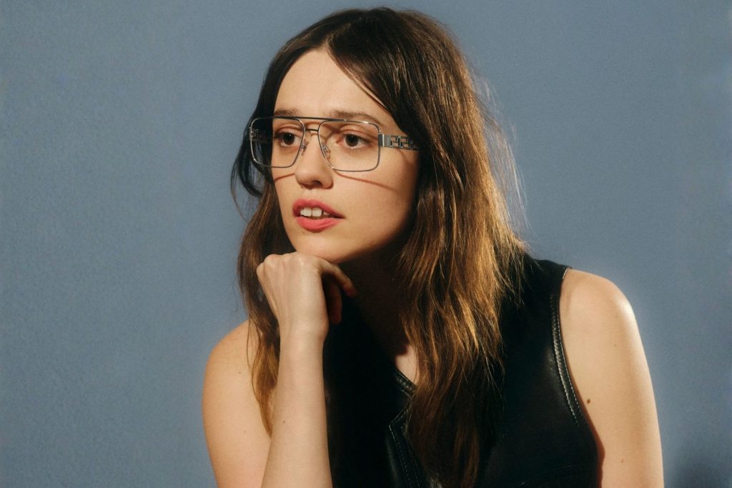 Actress Amy Lou Wood wearing oversized Versace glasses