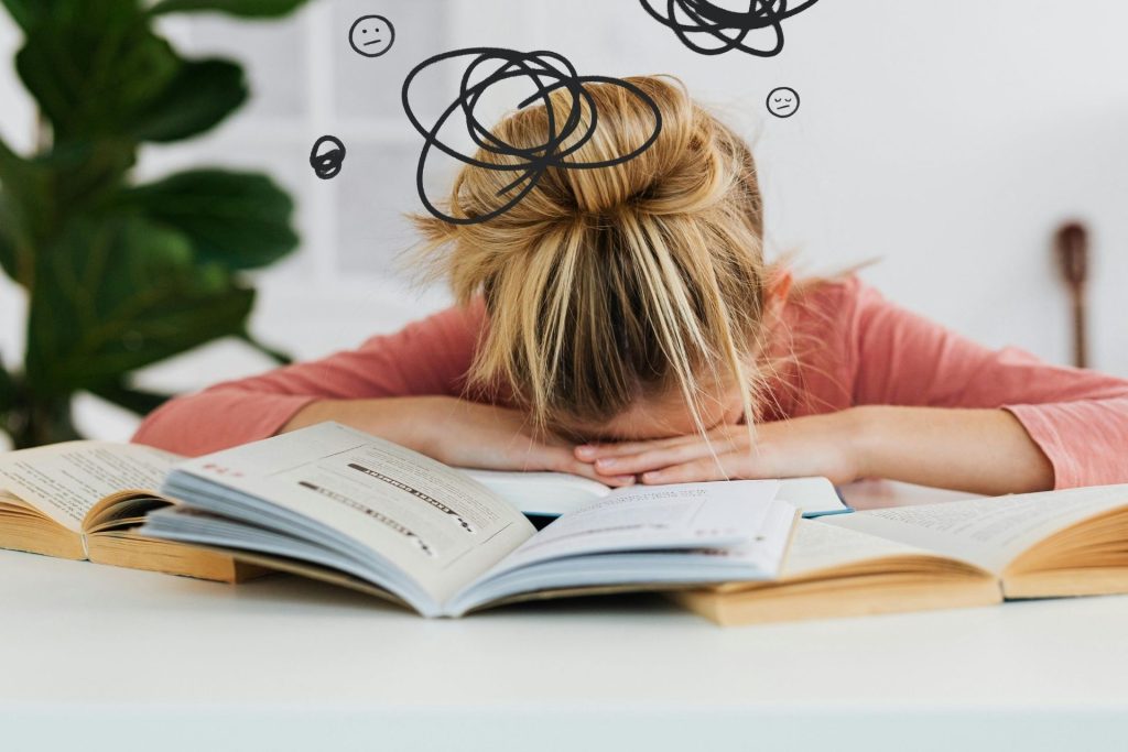 Girl buries her head in her books