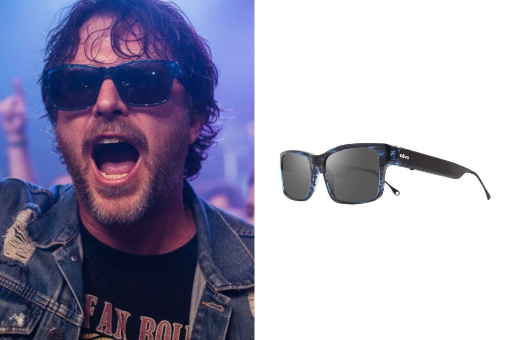 A rock fan wearing sunglasses at a concert