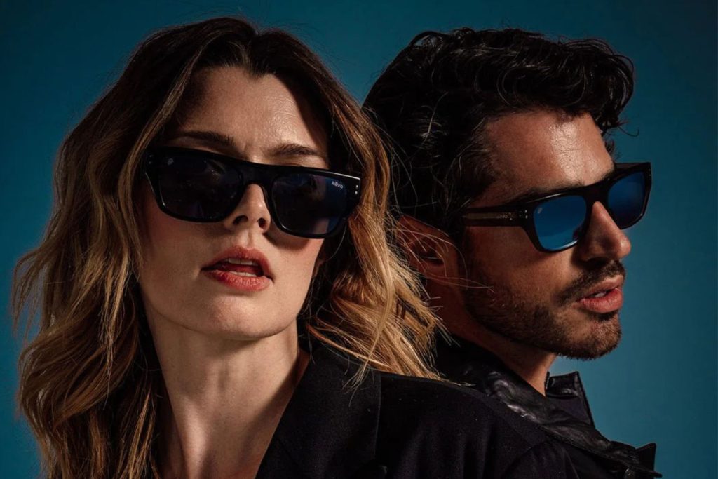 Man and woman wear happy sunglasses