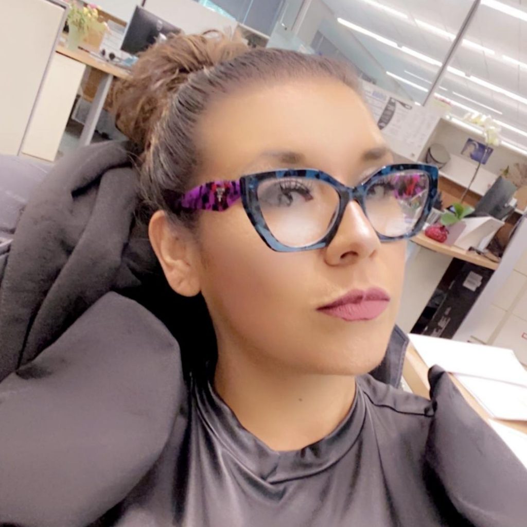 Customer wearing Prada PR 09YV glasses