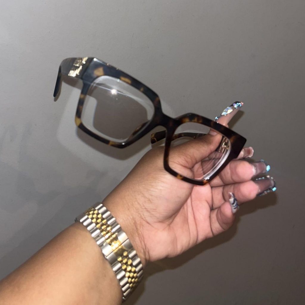 Miu Miu MU 04UV glasses featuring tortoise frames