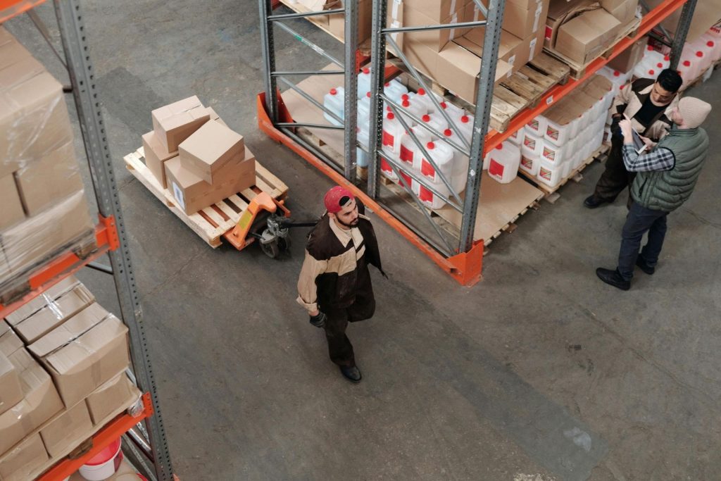 Man pulls boxes on a pallet
