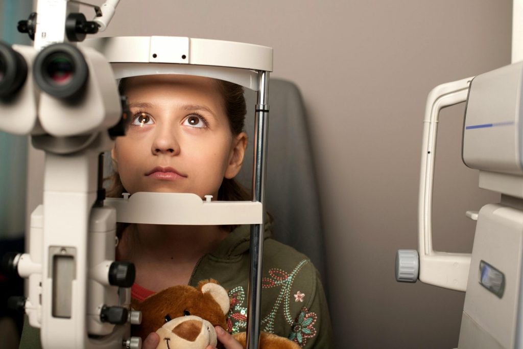 Little girl getting an eye exam