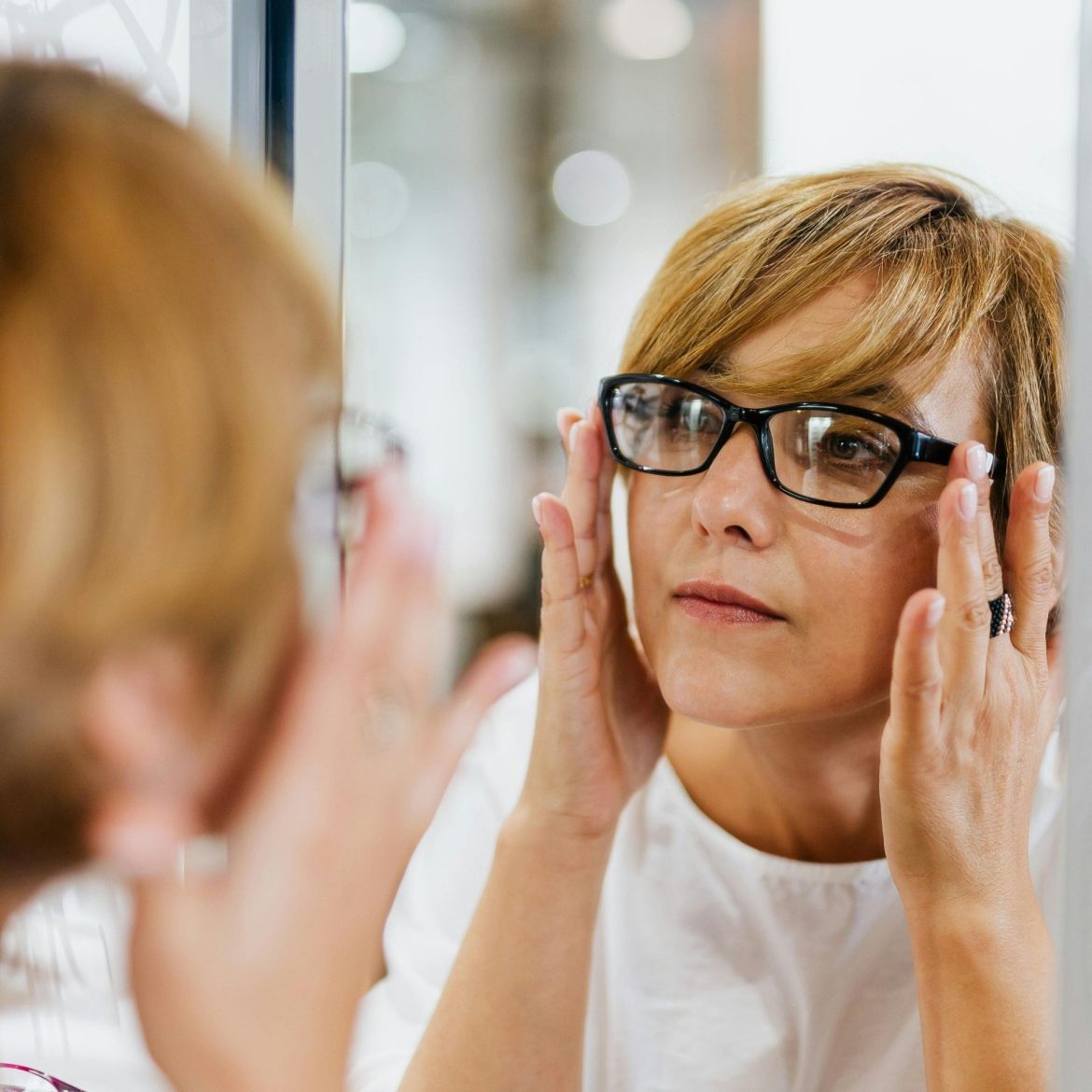 Woman tries on eyeglasses