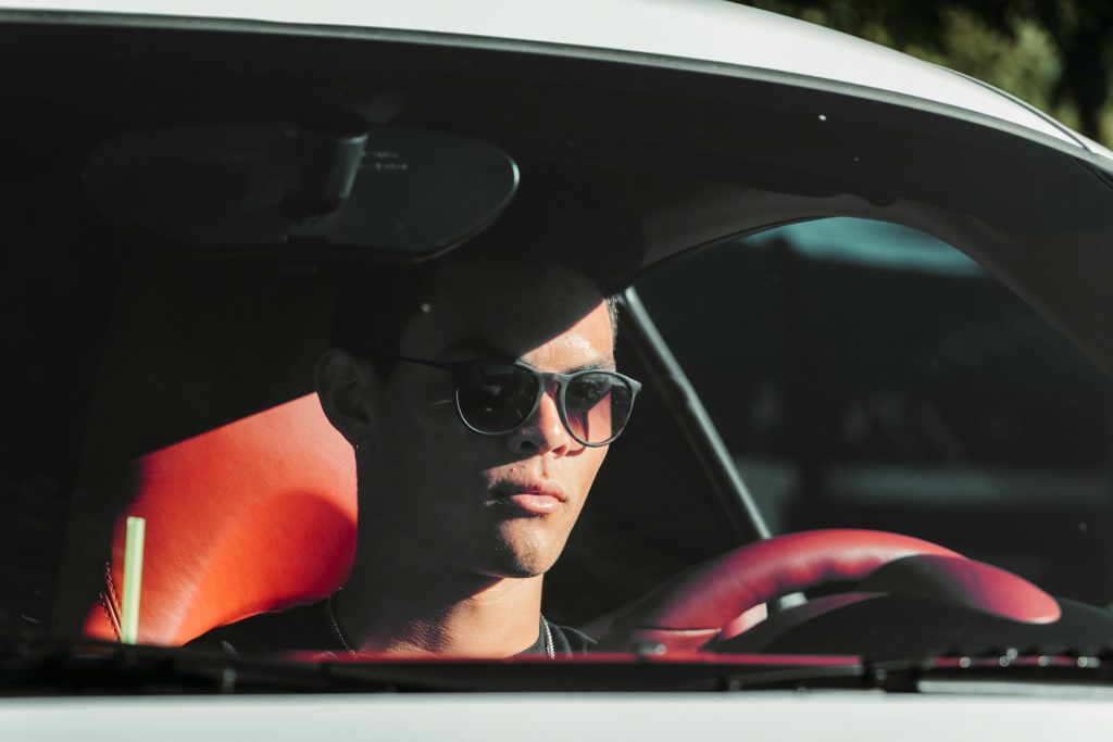 Man driving in sunglasses