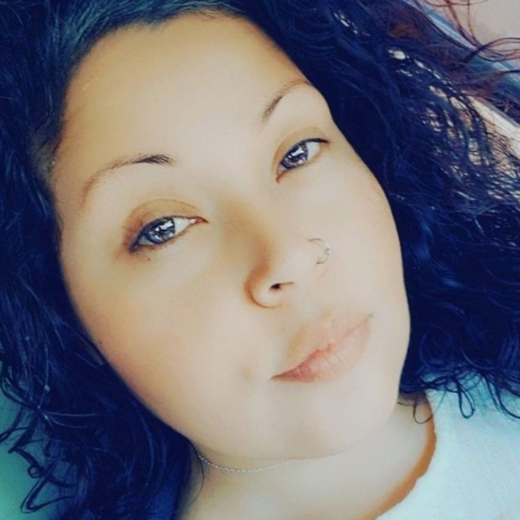 Woman wears amethyst contacts