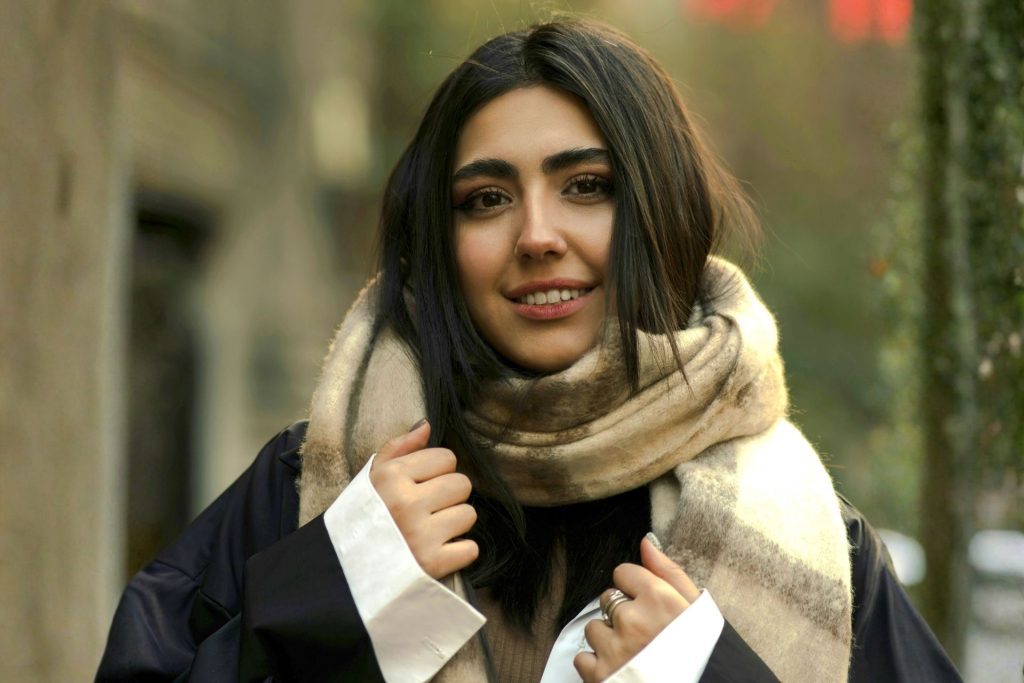 Woman wearing oversized check wool scarf