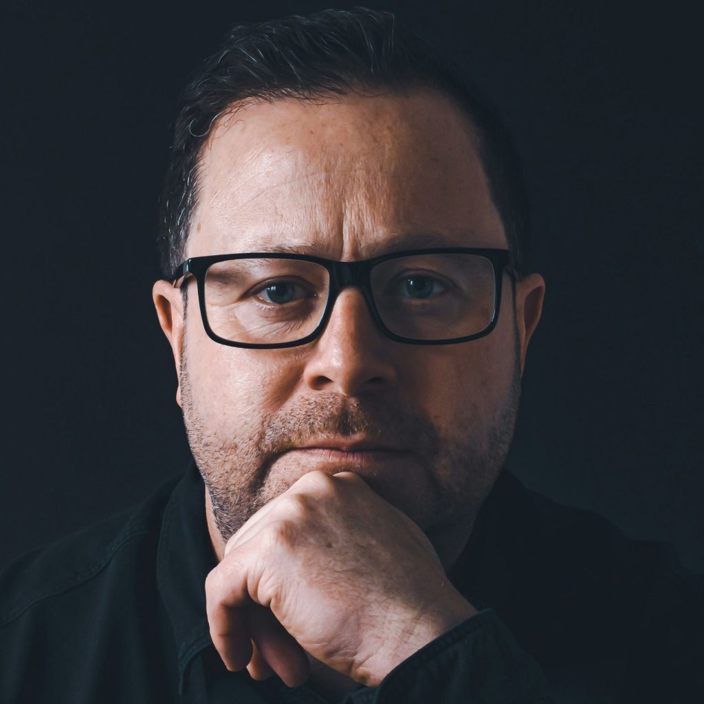 Man wearing rectangular black glasses