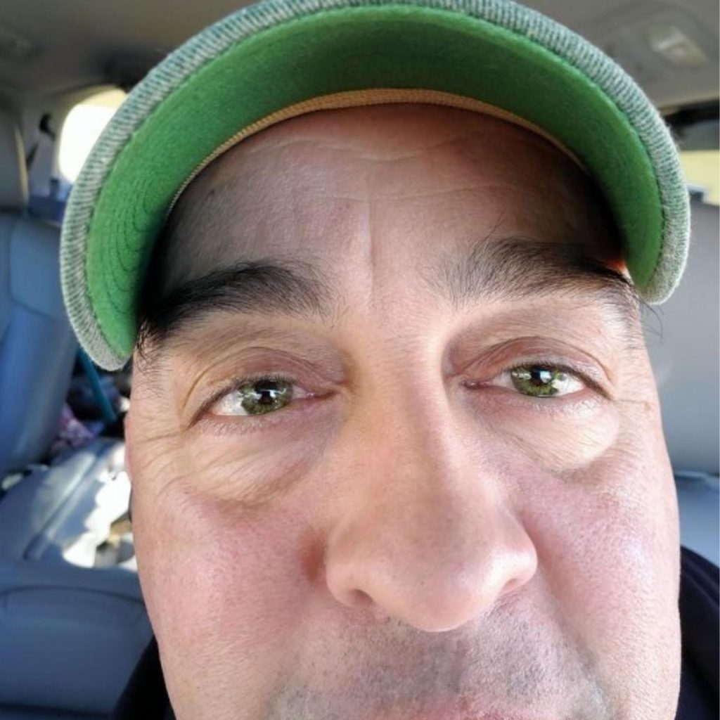 Man wears green AIR OPTIX contact lenses