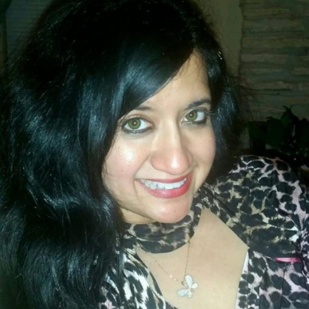 Woman wears green AIR OPTIX contact lenses