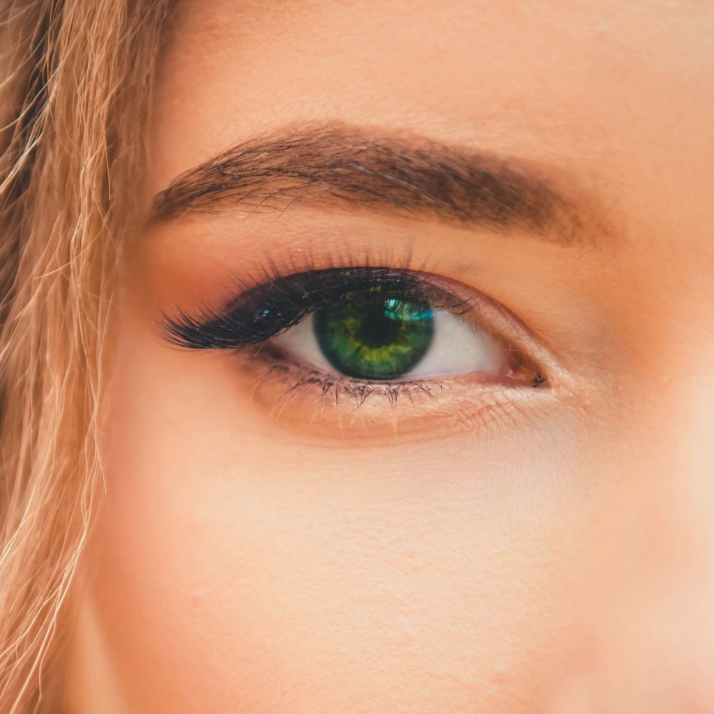 Woman wearing striking green contact lenses