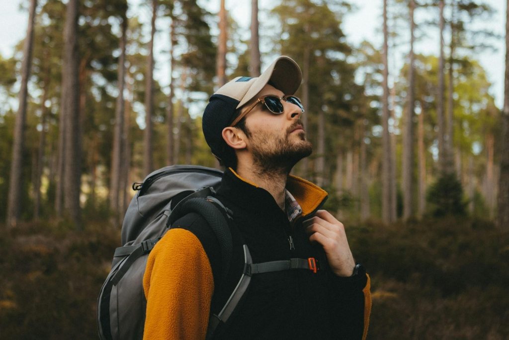 Man hikes in sunglasses