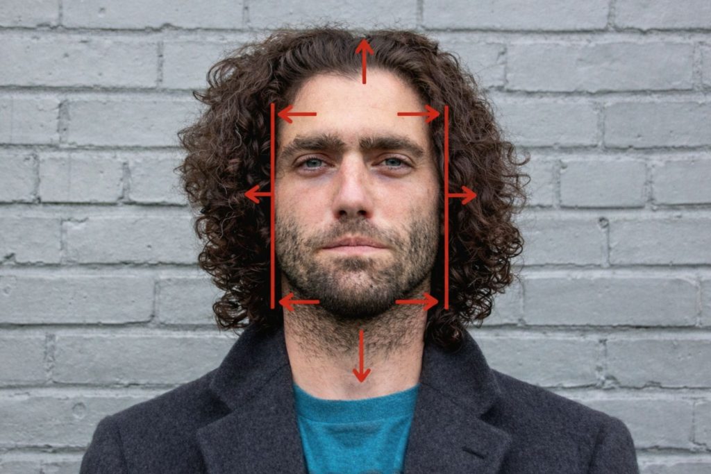 Man with curly hair and oblong face shape