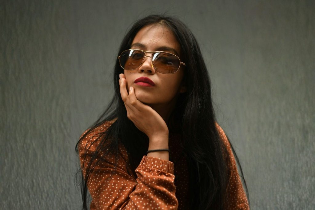 Woman wearing oversized sunglasses