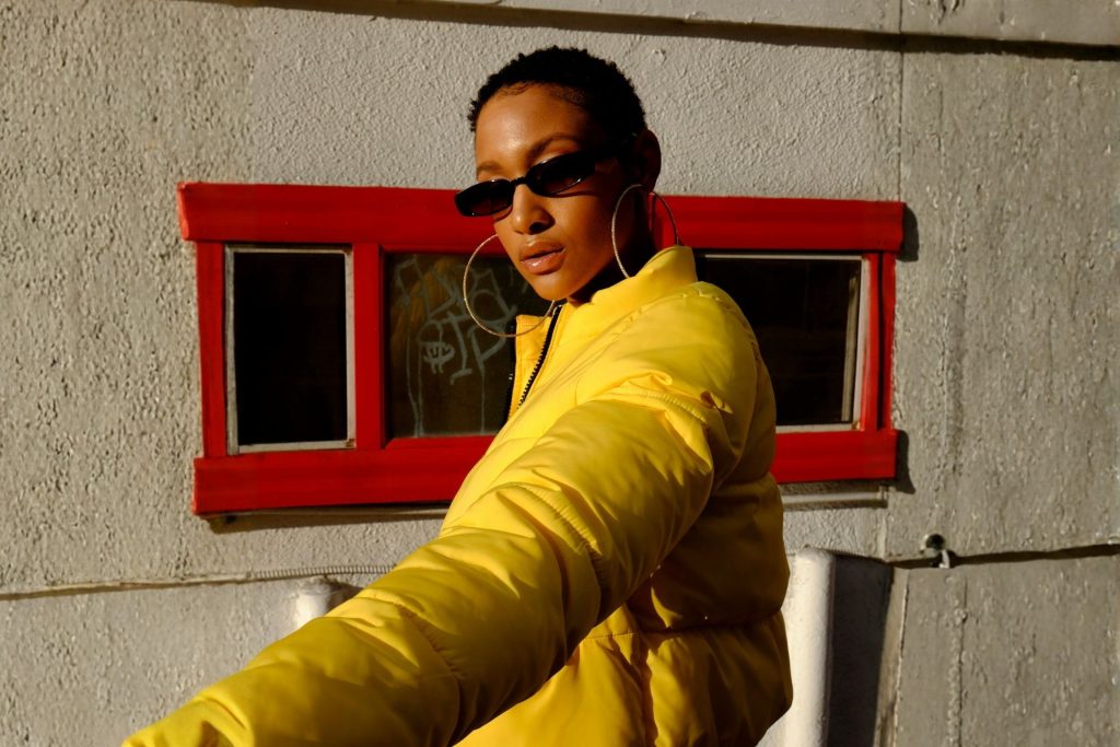 Woman wearing rectangular sunglasses