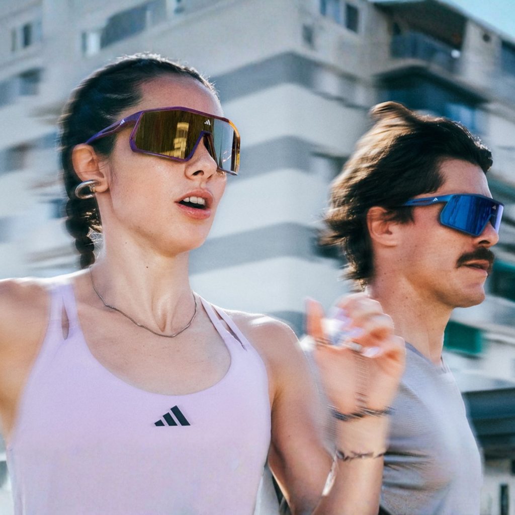 Couple running wearing Adidas Sport sunglasses