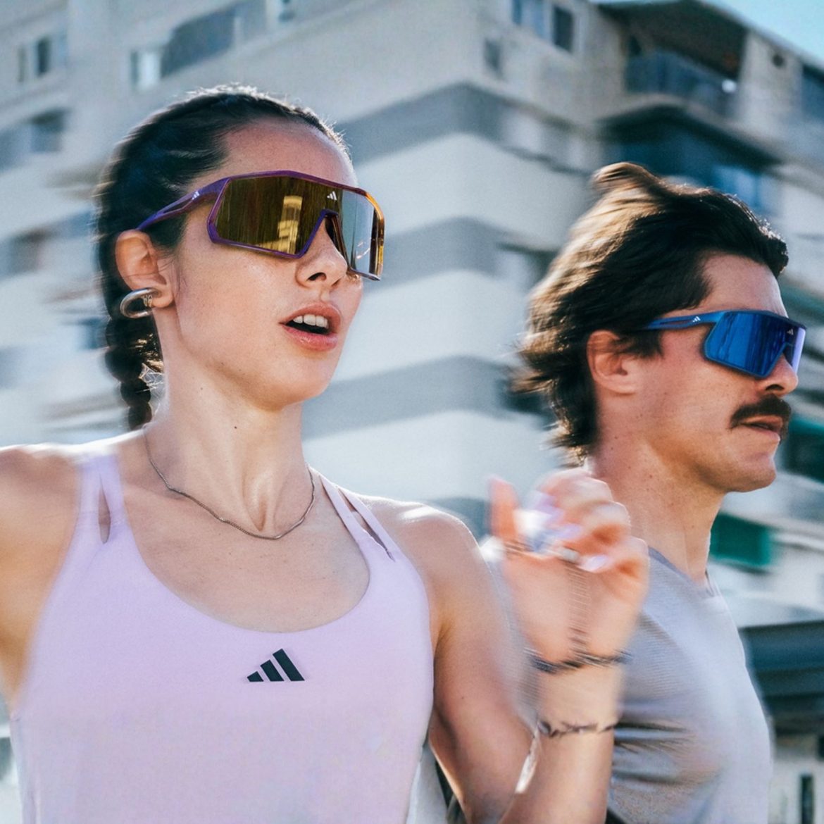 Couple running wearing Adidas Sport sunglasses