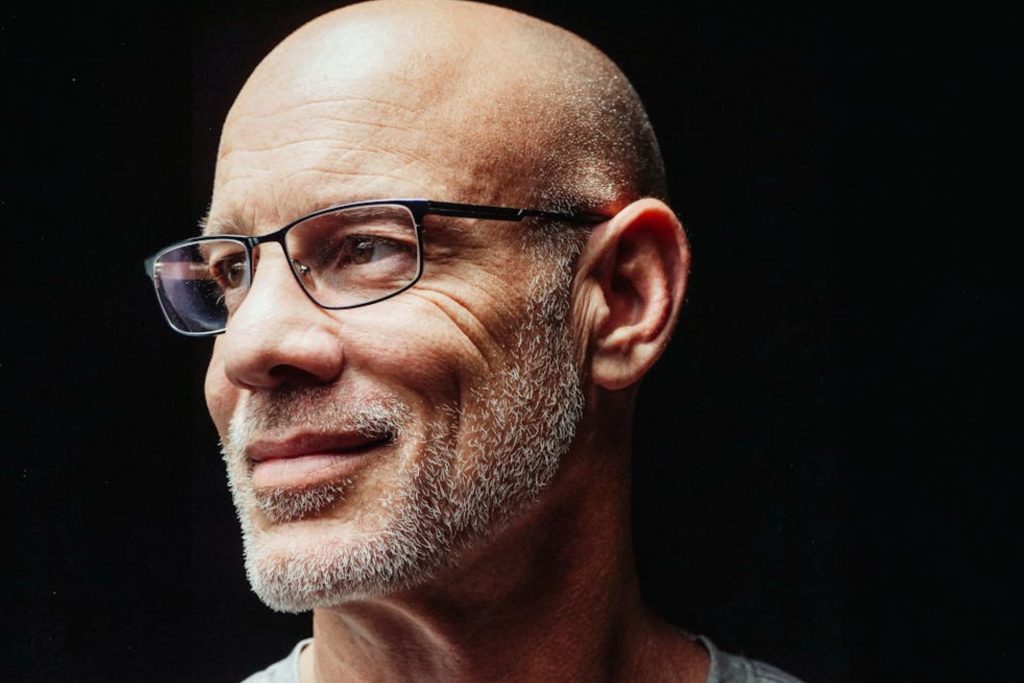 Man with oval face wears glasses