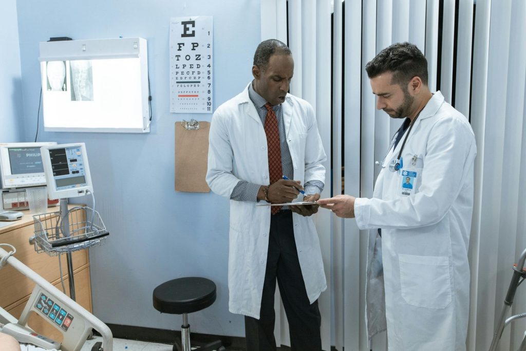 Two eye doctors discussing a chart