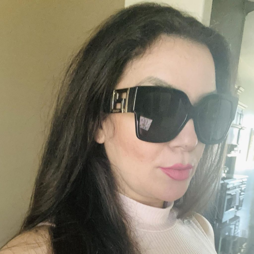 Woman wearing oversized Versace VE4402 shades