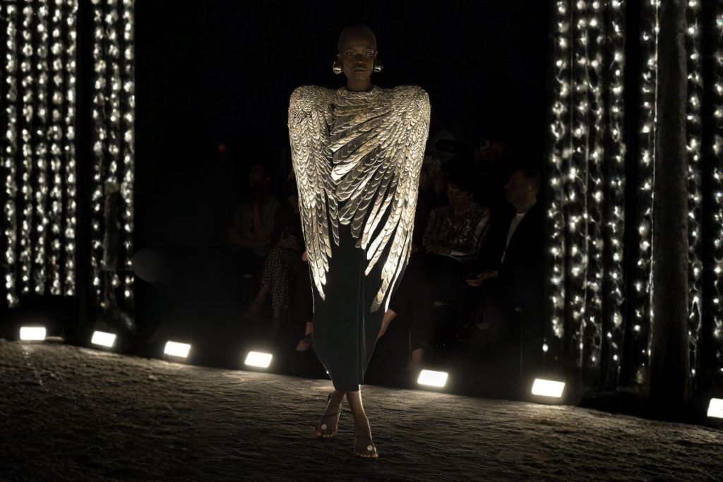 Model wearing angel wings at Schiparelli Couture Catwalk