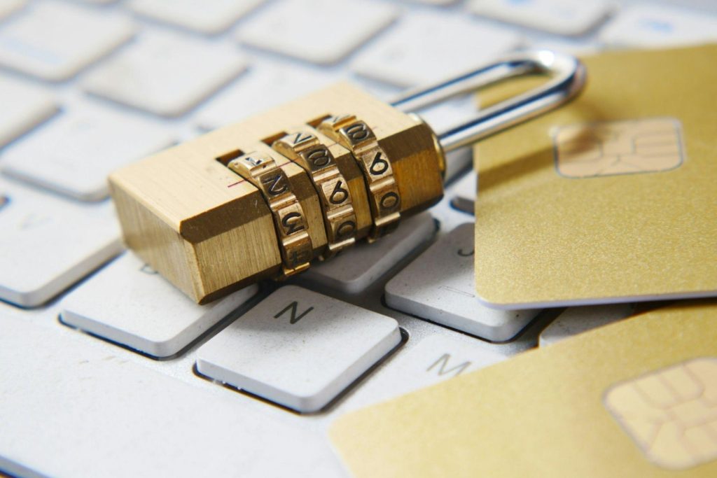 A lock and credit cards on a laptop keyboard 