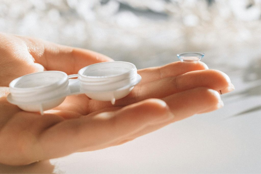 Woman holds contact lens case
