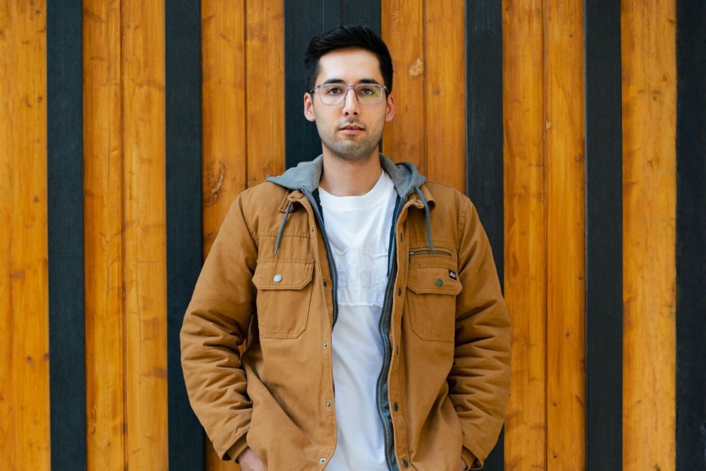 Man with a rectangular face wearing glasses
