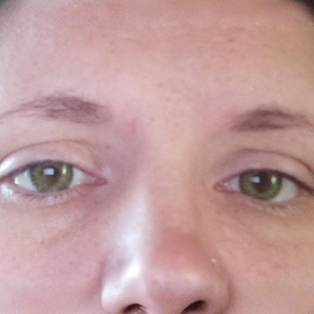 Woman wearing green contact lenses