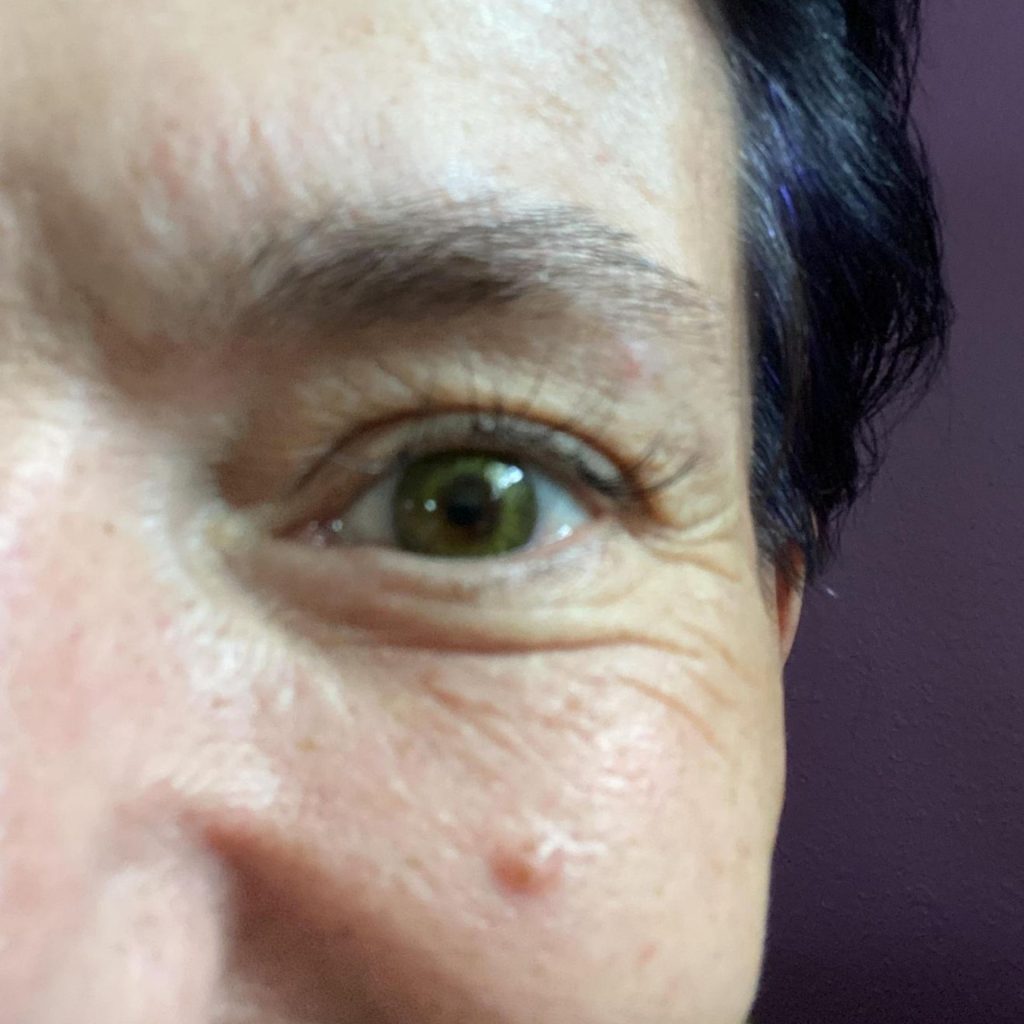 Woman wearing green contact lens