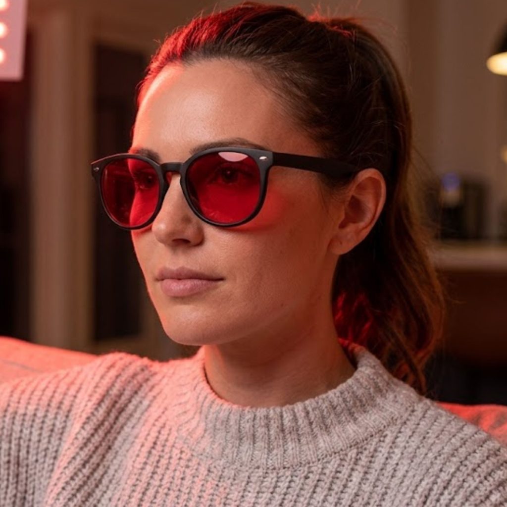Woman wearing red light glasses
