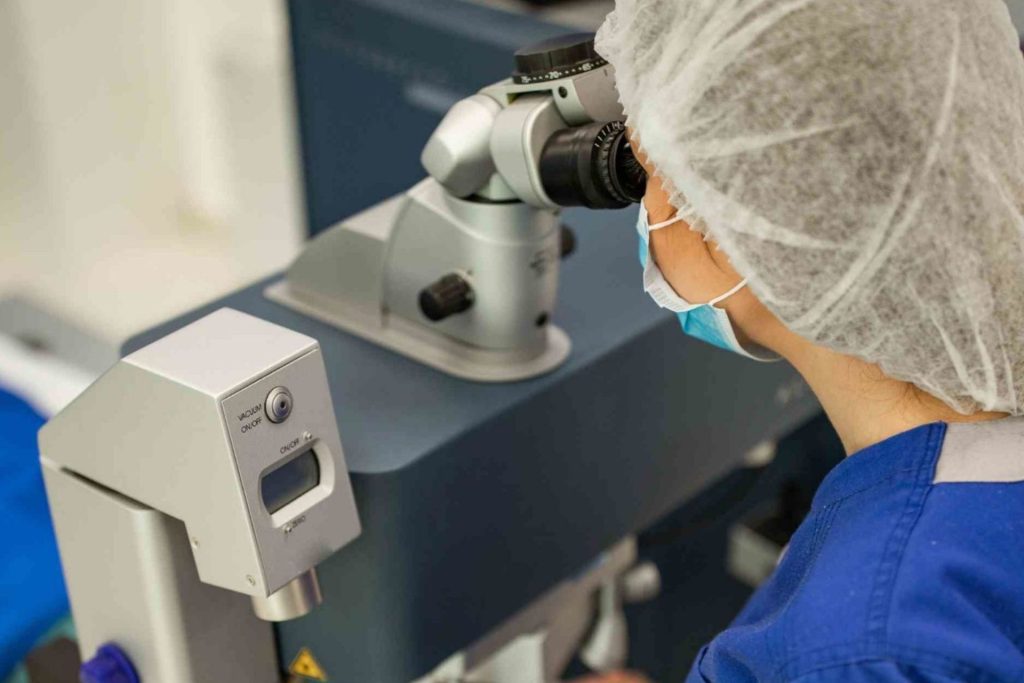 A doctor performing laser eye surgery