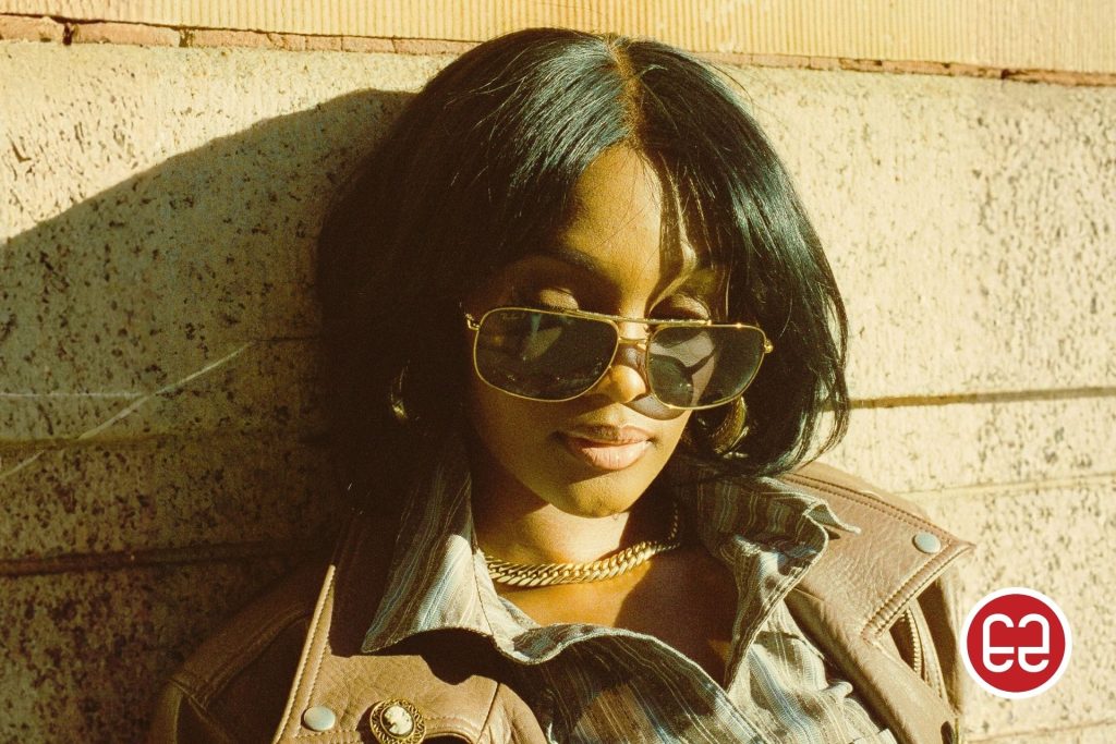 Woman wearing gold aviator sunglasses