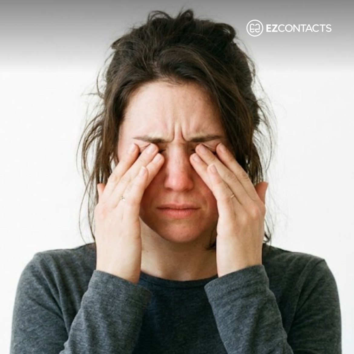Woman rubbing her eyes
