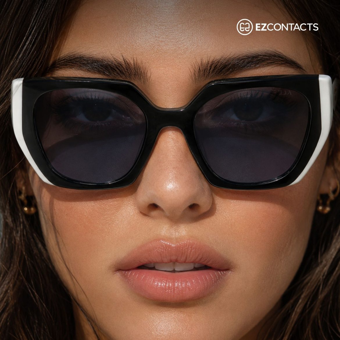 Close-up of woman wearing flat-top sunglasses