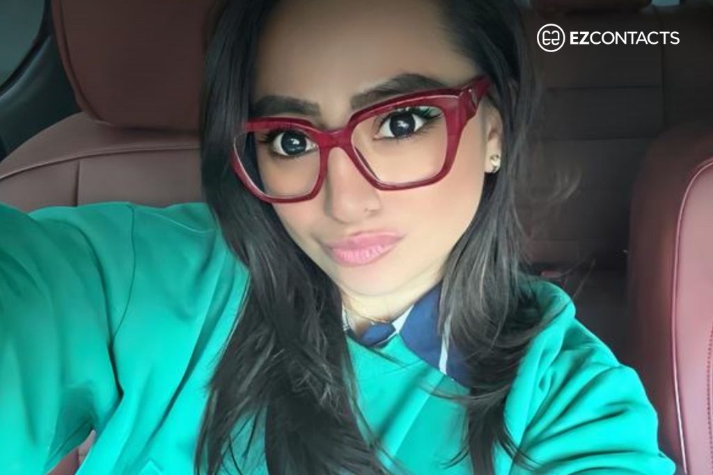 Woman wearing Prada PR 09ZV glasses