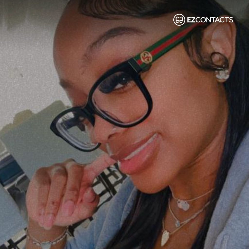 Woman wearing Gucci glasses and smiling