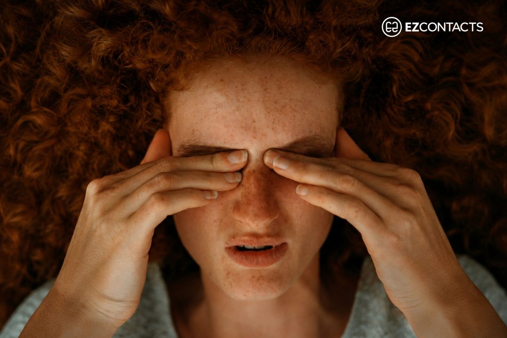 Woman rubbing her eyes