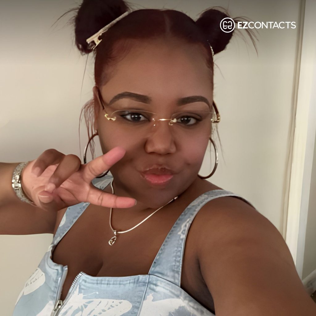Woman giving peace sign while wearing GG1221O glasses