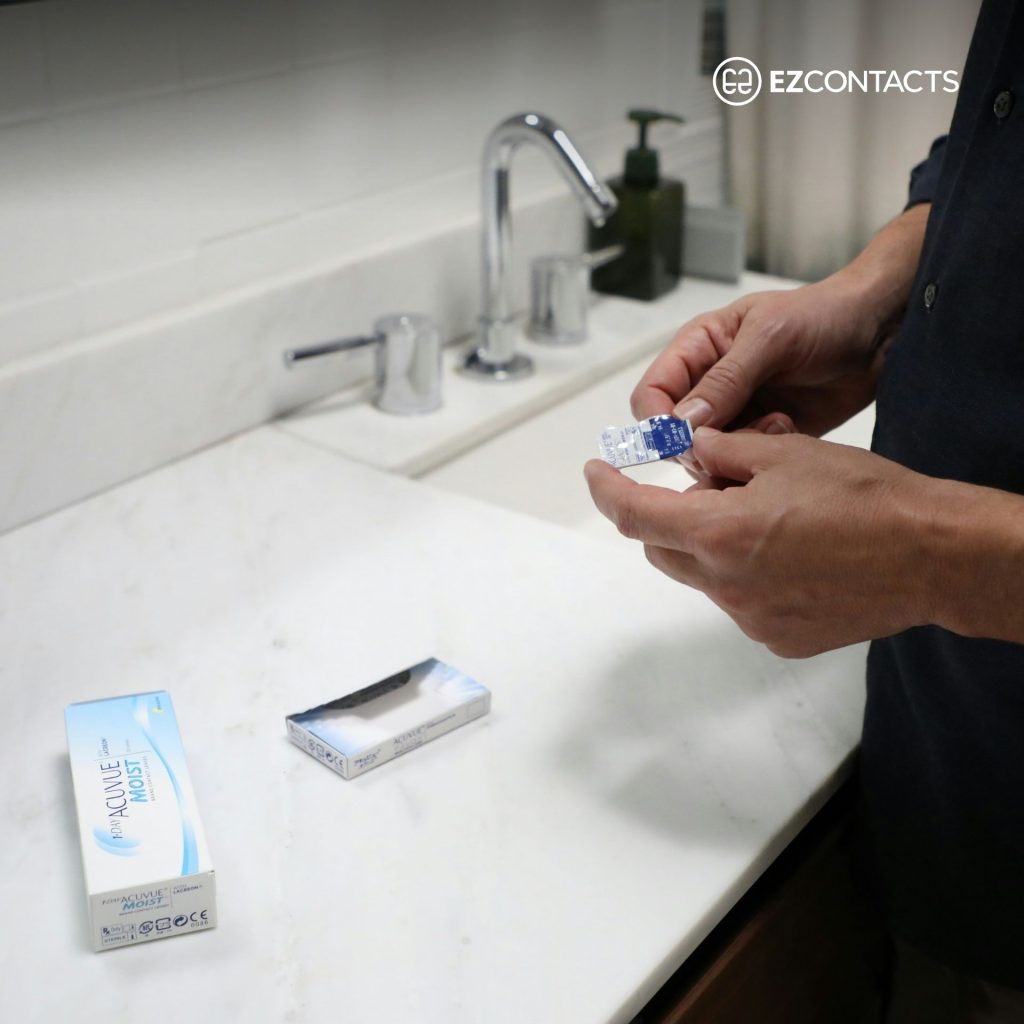 Person holding contact lens