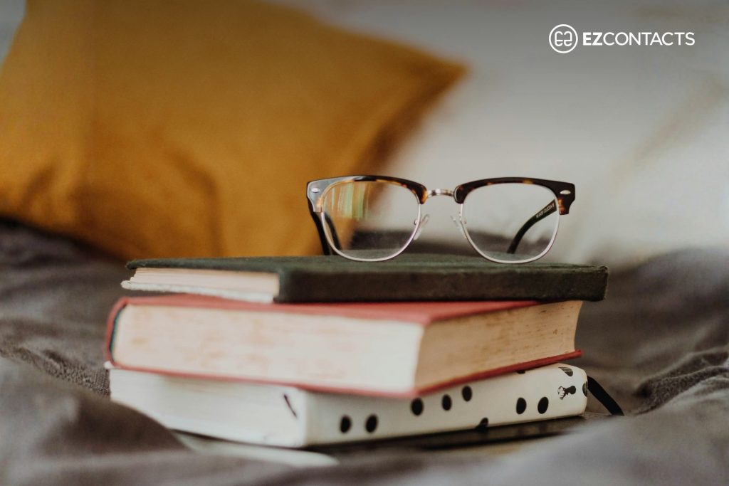 Glasses on a stack of books