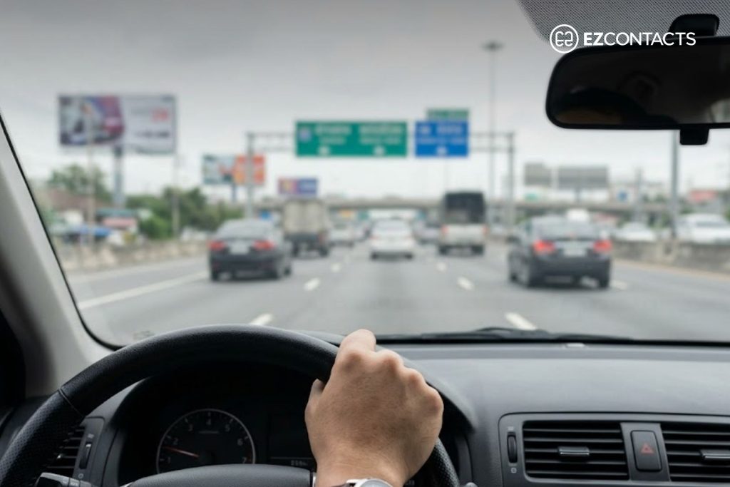 Person driving on the highway with foreground in focus and distance blurred