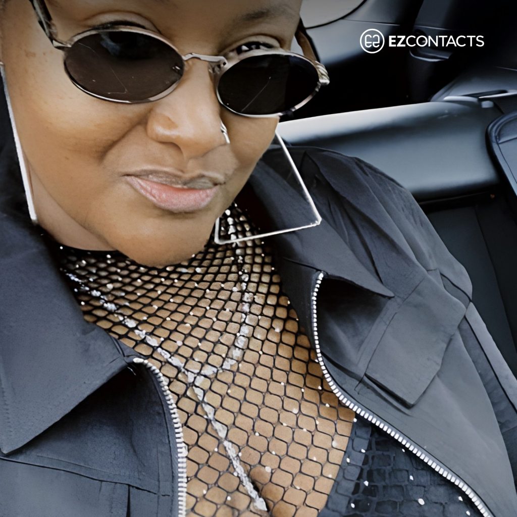 Woman wearing Prada PR 65ZS sunglasses