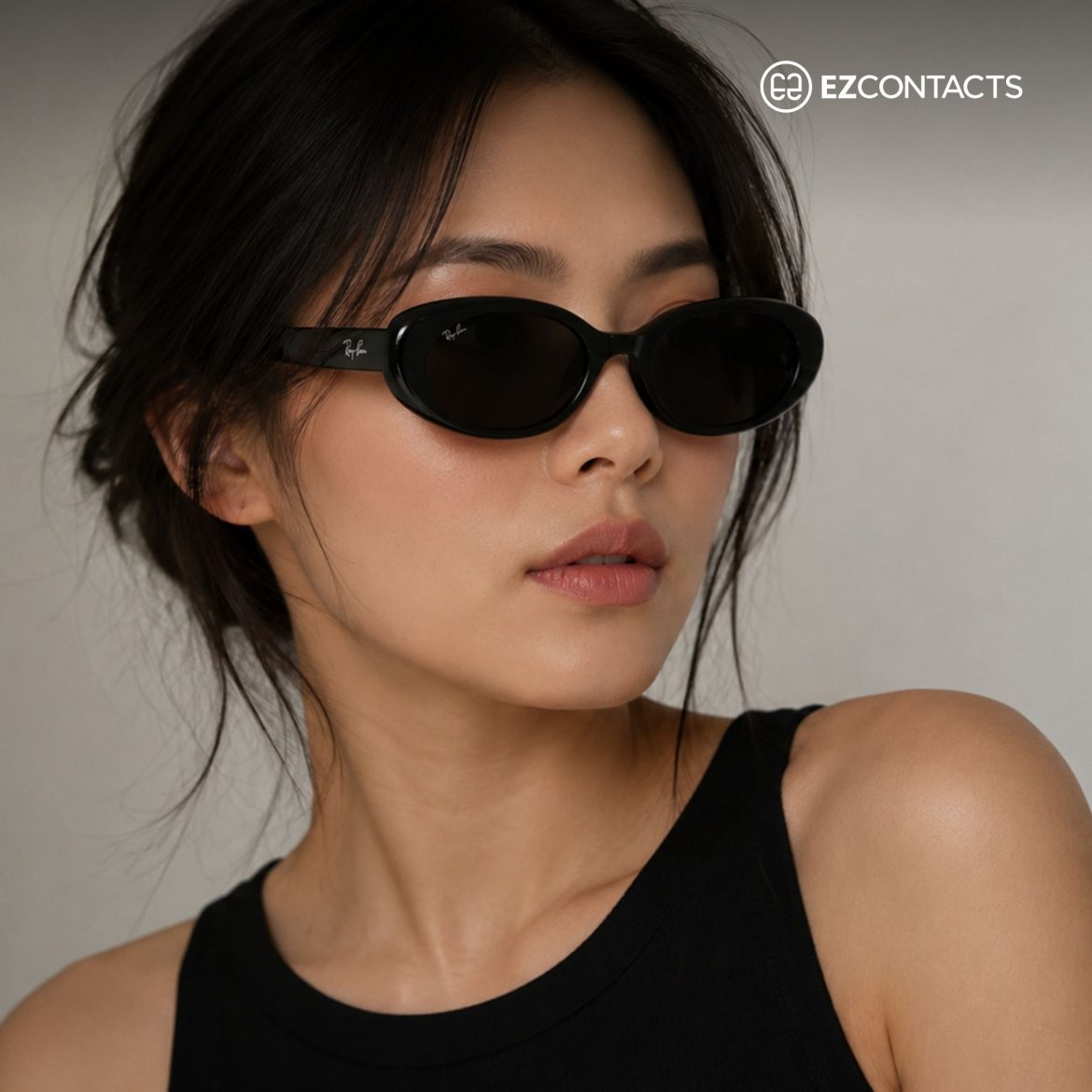 Woman wearing black Ray Ban RB4441D sunglasses