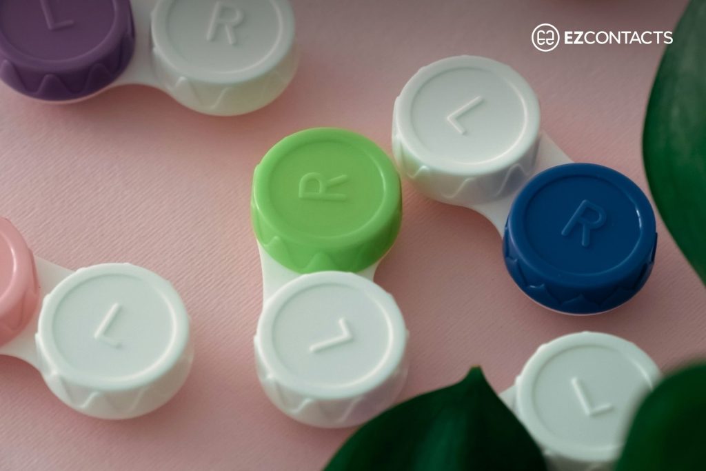 Contact lens cases on pink background