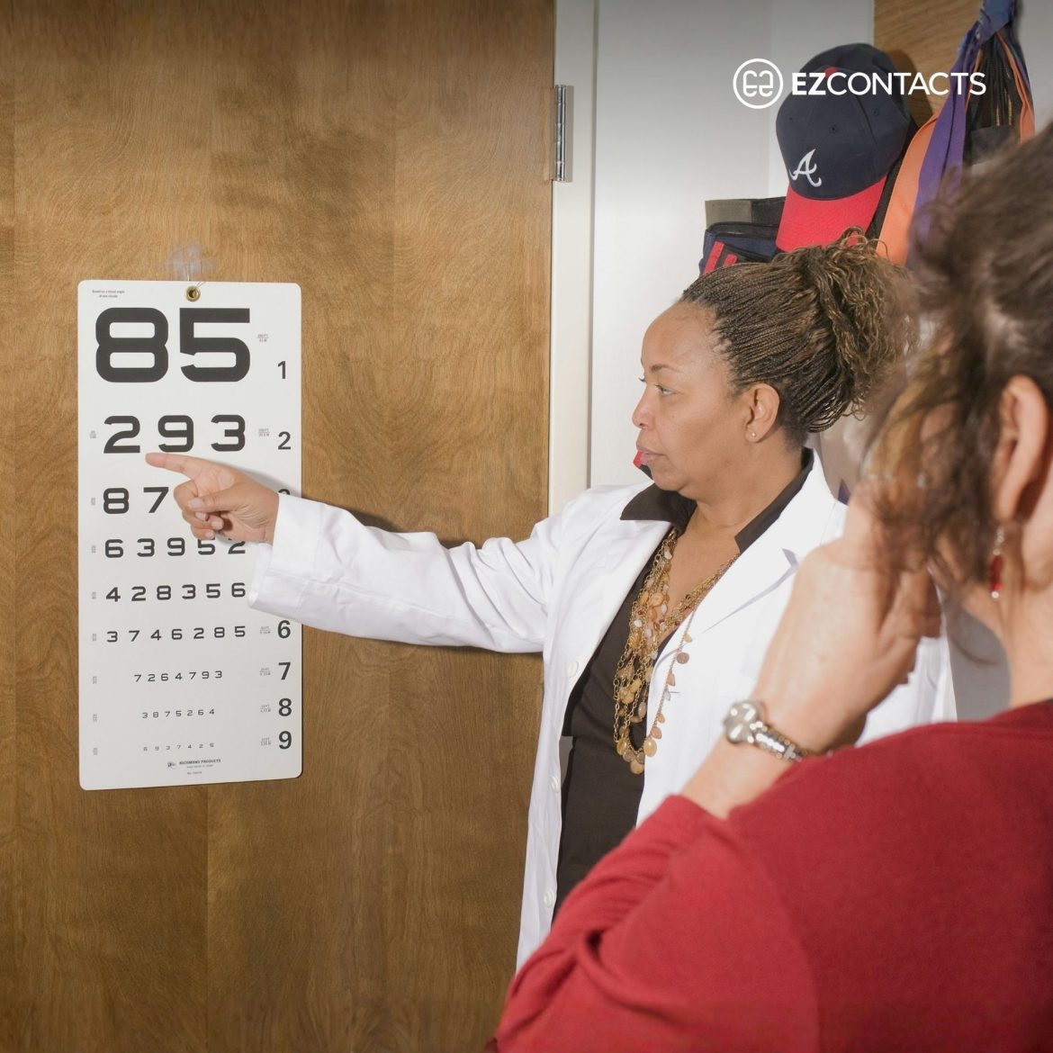 Doctor Pointing at Eye Chart