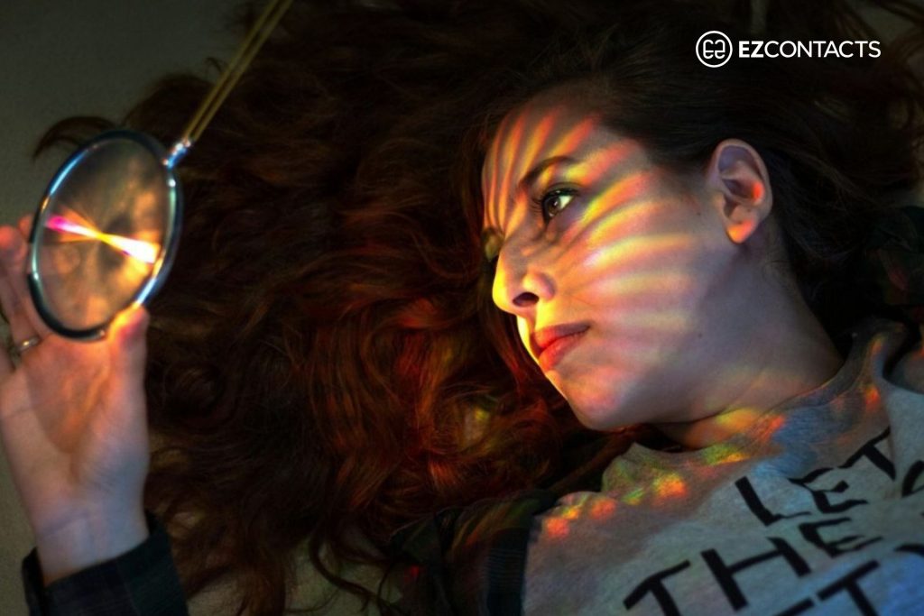 Woman with sun rays on face