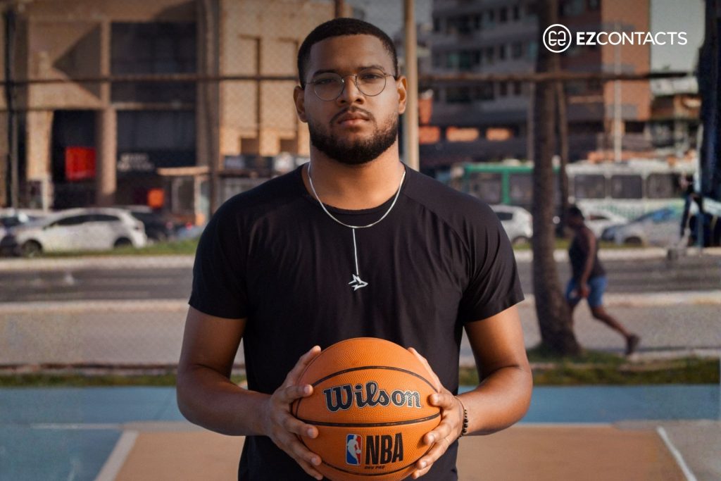 Man wearing glasses holding a basketball